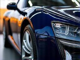 Shiny luxury car exterior with polished paint and chrome finishes
